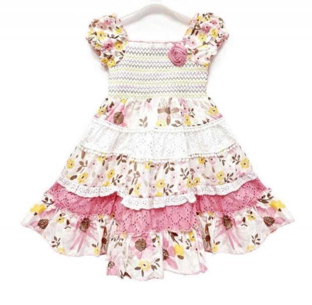 Floral ruffle toddler girl dress with puff sleeves, lace trim, and pink rosette detail on a hanger