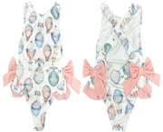 Adorable pastel hot air balloon swimsuit for baby girls with pink side bows. Perfect for beach, pool, and sunny summer days. Sizes 6–24 months.